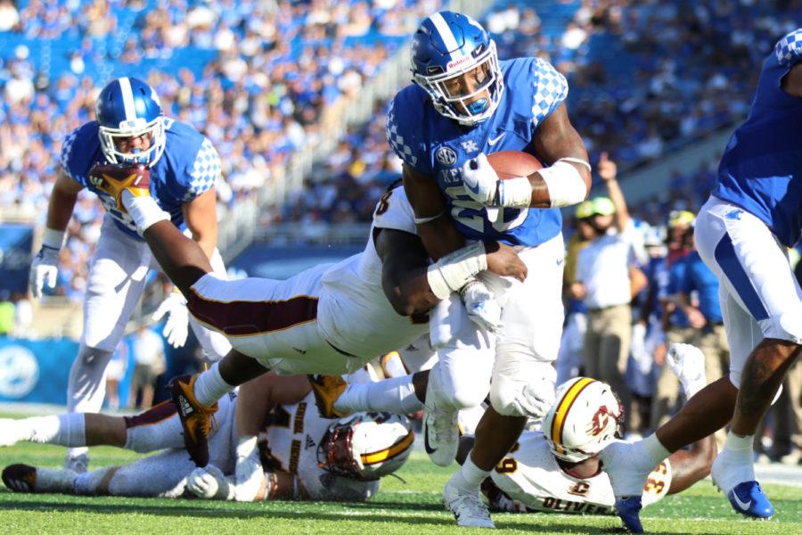 Benny Snell breaks a tackle and scores a touchdown during the game against Central Michigan on Saturday, September 1, 2018 in Lexington, Ky. Photo by Chase Phillips | Staff