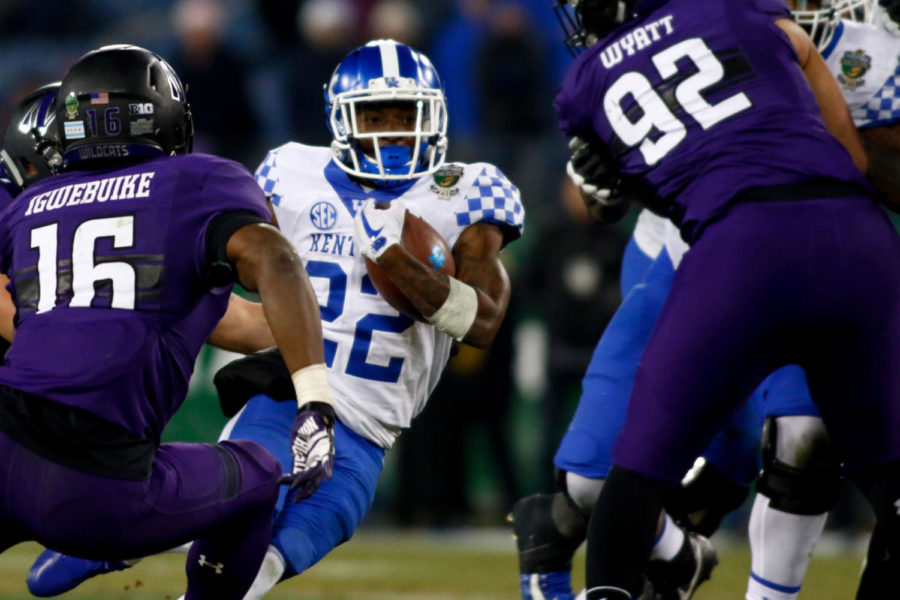 Kentucky Wildcats running back Sihiem King runs down the field during the Music City Bowl game against Northwestern on Friday, December 29, 2017 in Nashville, Tennessee. Kentucky was defeated 24-23. Photo by Arden Barnes | Staff