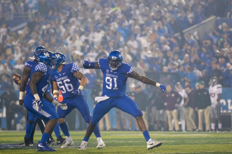 Kentucky Wildcats defensive end Calvin Taylor Jr. (91) celebrating after a sack. University of Kentucky football beat No. 14 Mississippi State to stay undefeated in the season on Saturday, September 22nd, 2018 in Lexington, Kentucky. Photo by Michael Clubb | Staff