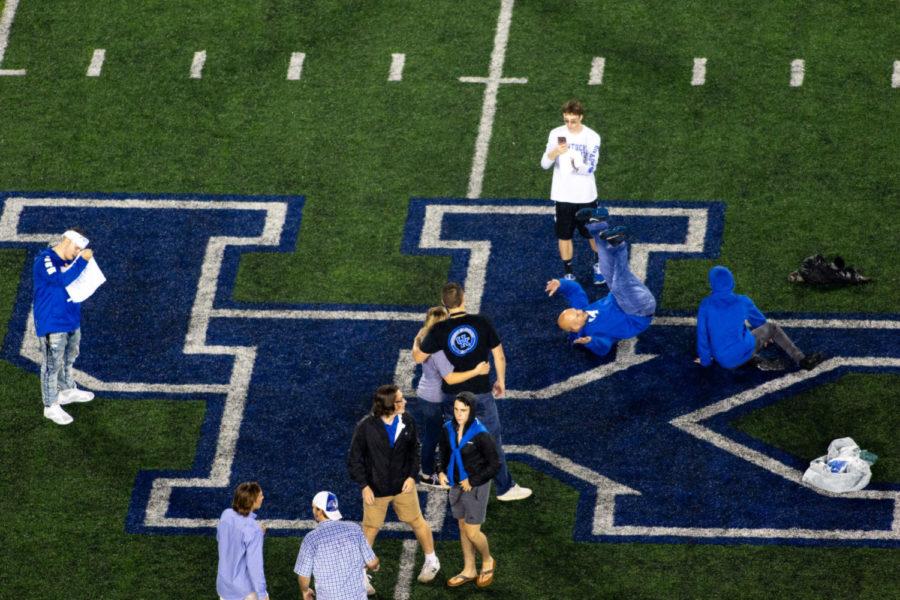 Kentucky Wildcats fans take pictures on the field after the game against Mississippi State on Saturday, Sept. 22, 2018, in Lexington, Kentucky. Kentucky won 28 to 7. Photo by Jordan Prather | Staff