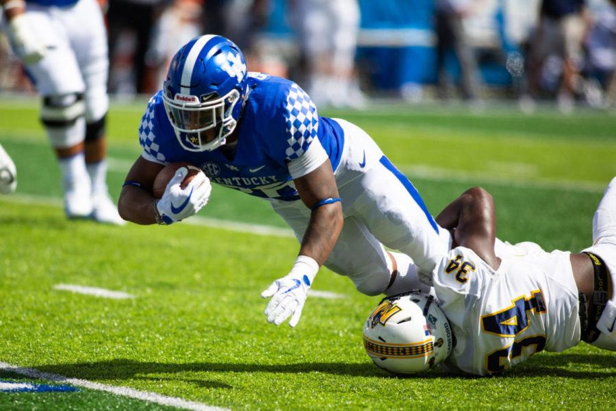 Kentucky Wildcats running back Benny Snell Jr. (26) is tackled during the game against Murray State on Saturday, Sept. 15, 2018, in Lexington, Kentucky. Kentucky defeated Murray 48-10. Photo by Jordan Prather | Staff