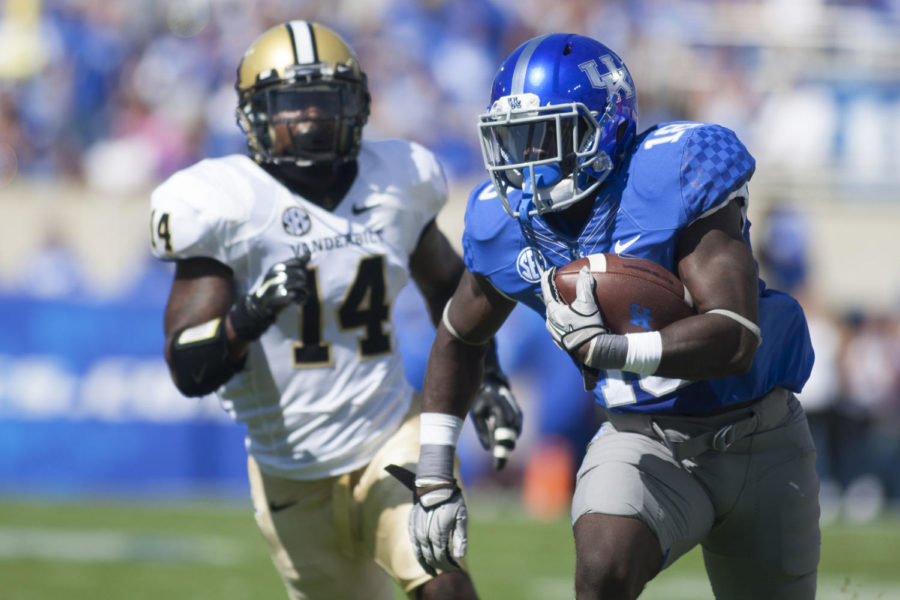 Kentucky Wildcats Stanley Boom Williams runs during the first half against the Vanderbilt University Commodores at Commonwealth Stadium on Saturday, September 27, 2014 in Lexington, Ky. Kentucky defeated Vanderbilt 17-7. Photo by Michael Reaves | Staff 