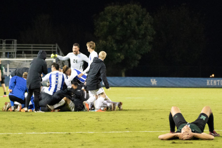 UK celebrates as a MU player lies down in defeat on the field. No. 5 University of Kentucky mens soccer team defeated Marshall University 1-0 in double overtime on Saturday, October 13th, 2018 in Lexington, Kentucky