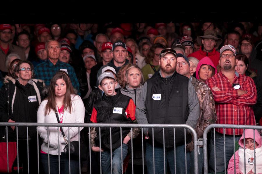 Trump supporters who were unable to gain entry to the rally watch President Donald Trumps speech on a large screen in the parking lot outside Alumni Coliseum. President Donald Trump held a rally in support of congressional candidate Andy Barr on Saturday, Oct. 13, 2018 on Eastern Kentucky Universitys campus in Richmond, Kentucky. Photo by Arden Barnes | Staff