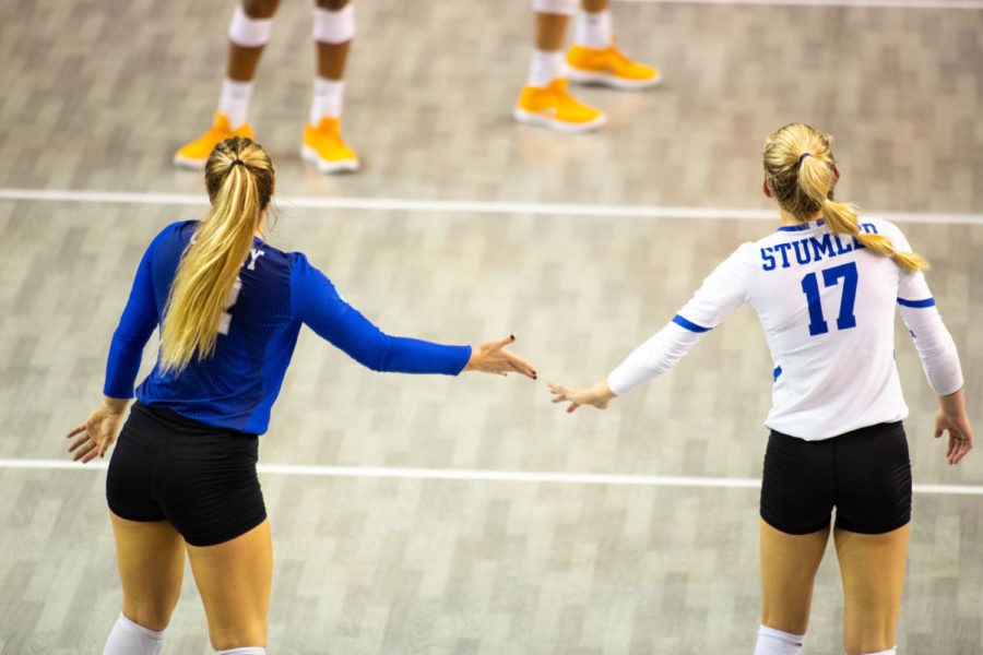 Sophomore Gabby Curry high-fives freshman Alli Stumler during the game against Tennessee on Thursday, Oct. 10, 2018 at Memorial Coliseum in Lexington, Ky. Kentucky won 3 sets to 1. Photo by Jordan Prather | Staff