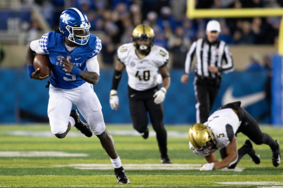 Kentucky Wildcats quarterback Terry Wilson (3) breaks off from a defender and runs with the ball. University of Kentucky football defeated Vanderbilt University 14-7 to become 6-1 on the season on Saturday, October 20, 2018 at Kroger Field in Lexington, Kentucky. Photo by Michael Clubb | Staff