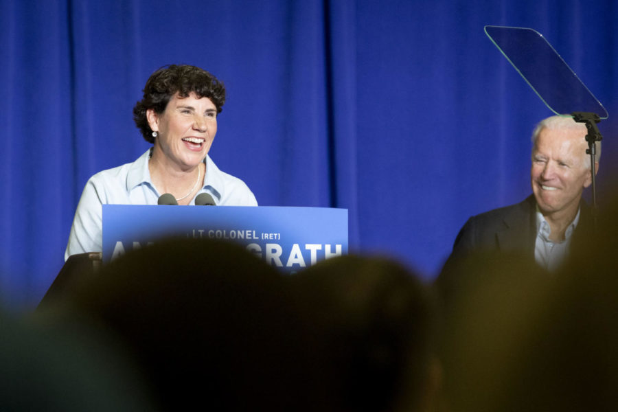 Lieutenant Colonel Amy McGrath addresses her supporters during the rally on Friday, Oct. 12, 2018, at Bath County High School in Owingsville, Kentucky. Former Vice President Joe Biden also attended the event and spoke on behalf of McGrath. Photo by Arden Barnes | Staff