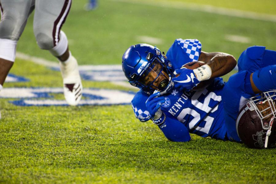 Kentucky Wildcats running back Benny Snell Jr. (26) is tackled during the game against Mississippi State on Saturday, Sept. 22, 2018, in Lexington, Kentucky. Photo by Jordan Prather | Staff