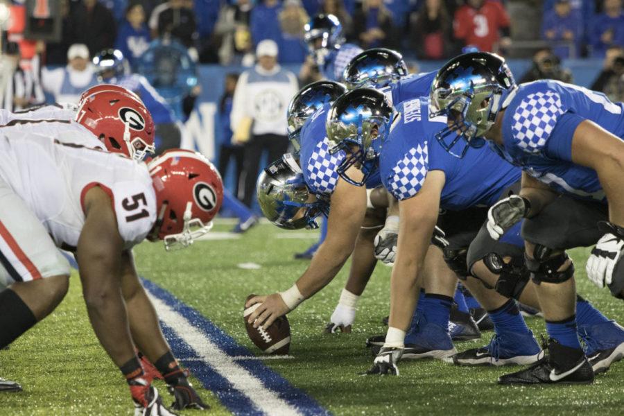 Kentuckys offensive line preparing to snap the ball during the game against the Georgia Bulldogs at Commonwealth Stadium in Lexington, Ky. on Saturday, November 5, 2016. Photo by Josh Mott | Staff.