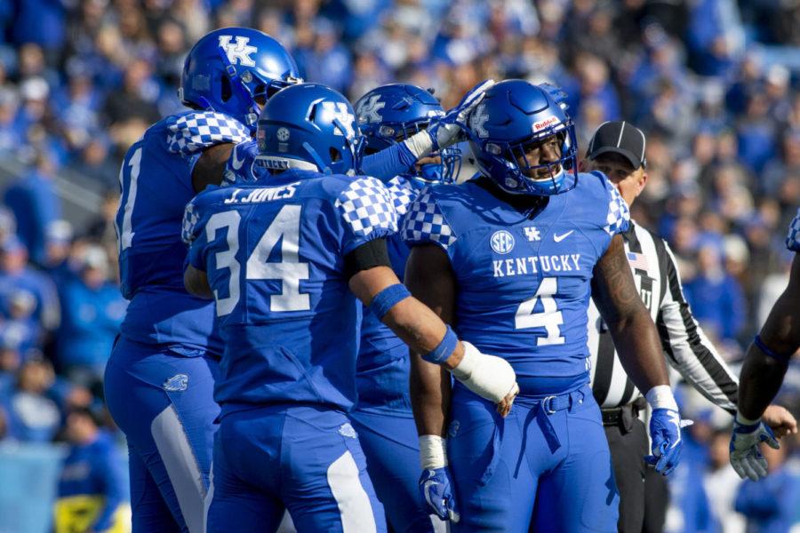 Kentucky celebrates Josh Paschal’s (4) first tackle since being diagnosed with cancer during the game against the Middle Tennessee Blue Raiders on Saturday, Nov. 17, 2018, at Kroger Field, in Lexington, Kentucky. Today, Paschal made his season debut after battling cancer. Kentucky defeated MTSU 34-23. Photo by Arden Barnes | Staff