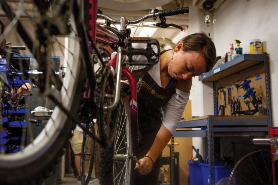 Sophomore mechanical engineering major Abigail Masterson works on a bike on Oct. 1, 2018, in the Wildcat Wheels workshop on UKs campus in Lexington, Kentucky. Photo by Arden Barnes | Staff.