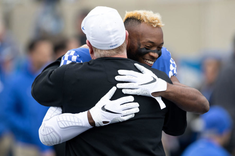 Kentucky Wildcats safety Mike Edwards (7) hugging head coach Mark Stoops during the Senior Day ceremony before the game. University of Kentucky football defeated Middle Tennessee State University 34-23 at Kroger Field on Saturday, Nov. 17, 2018 in Lexington, Kentucky. Photo by Michael Clubb | Staff