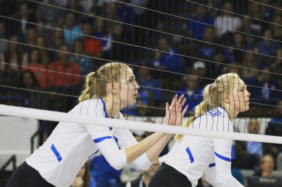 Sophomore Kendyl Paris and Freshman Alli Stumler get ready to block during the senior night game against Auburn at Memorial Coliseum on Saturday November 24, 2018 in Lexington, Kentucky. Kentucky defeated Auburn 3-0. Photo by Olivia Beach | Staff