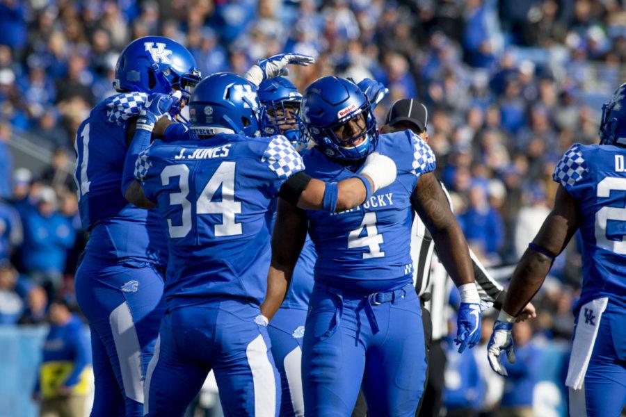 Kentucky celebrates Josh Paschal’s (4) first tackle since being diagnosed with cancer during the game against the Middle Tennessee Blue Raiders on Saturday, Nov. 17, 2018, at Kroger Field, in Lexington, Kentucky. Today, Paschal made his season debut after battling cancer. Kentucky defeated MTSU 34-23. Photo by Arden Barnes | Staff