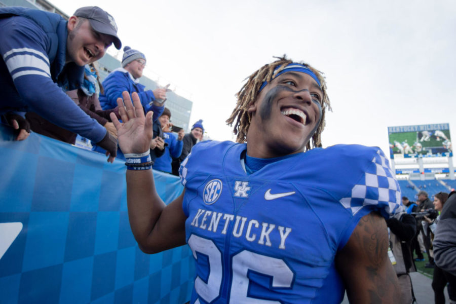 Kentucky running back Benny Snell Jr. high fives fans after UK's win over MTSU. University of Kentucky football defeated Middle Tennessee State University 34-23 at Kroger Field on Saturday, Nov. 17, 2018 in Lexington, Kentucky. Photo by Michael Clubb | Staff