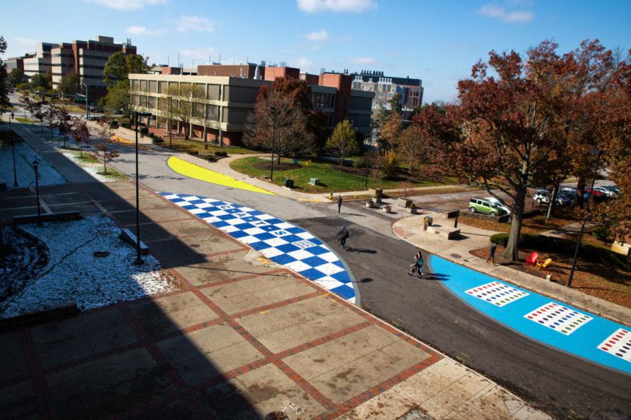 A portion of Rose street is lined with painted half-circles in front of Rose street garage and Don and Cathy Jacobs Science Building at the University of Kentucky in Lexington, Kentucky. Photo by Jordan Prather | Staff