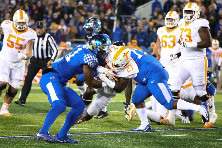 Kentucky Wildcats linebacker Josh Allen blocks Tennessee Volunteers running back Carlin Fils-aime during the game against Tennessee at Kroger Field in Lexington, Ky. Kentucky won 29-26 on Saturday, October 28, 2017.