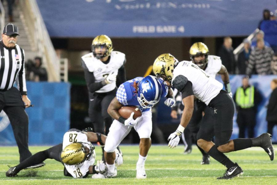 Lynn Bowden Jr. attempts to break a tackle during the game Vanderbilt on Saturday, October 20, 2018 in Lexington, Ky. Photo by Chase Phillips | Staff