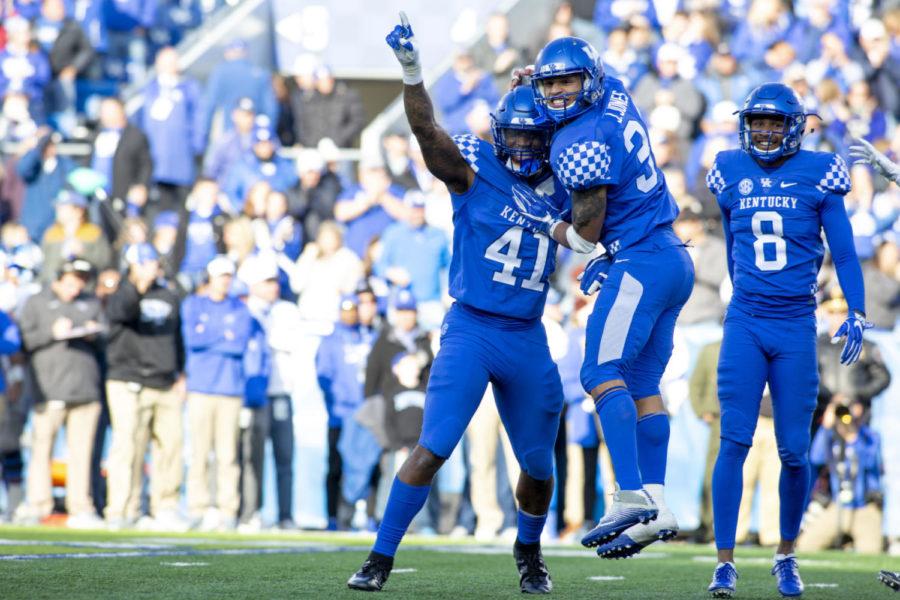 Kentucky Wildcats linebacker Josh Allen (41), Kentucky Wildcats linebacker Jordan Jones (34) and Kentucky Wildcats cornerback Derrick Baity Jr. (8) celebrate after stopping a Middle Tennessee Blue Raiders play during the game on Saturday, Nov. 17, 2018, at Kroger Field, in Lexington, Kentucky. Kentucky defeated MTSU 34-23. Photo by Arden Barnes | Staff
