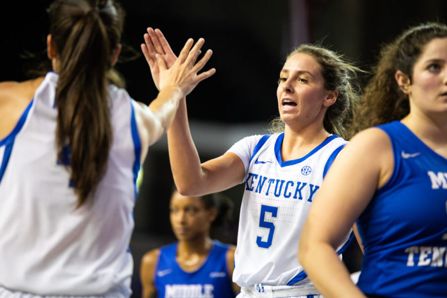 Freshman guard Blair Green high-fives senior guard Maci Morris after a play during the game against Middle Tennessee on Saturday, Dec. 15, 2018, at Memorial Coliseum in Lexington, Kentucky. Kentucky defeated the Blue Raiders 72-55. Photo by Jordan Prather | Staff