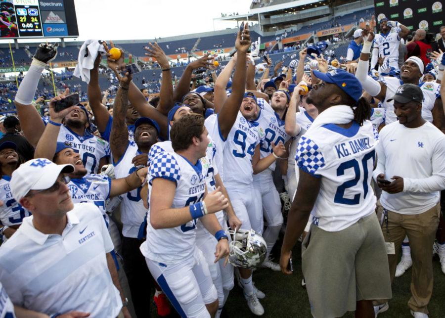 Kentucky players celebrate after winning the VRBO Citrus Bowl against Penn State on Tuesday, Jan. 1, 2019, at Camping World Stadium, in Orlando, Florida. Kentucky defeated Penn State 27-24. Photo by Arden Barnes | Staff