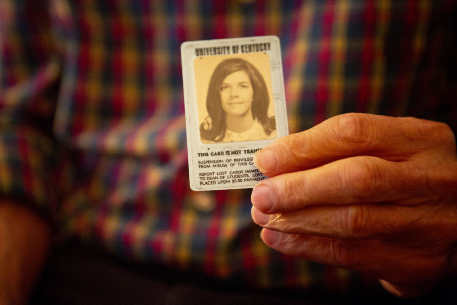 Neal holds Sues old University of Kentucky student ID. Sue was first an undergraduate at UK in the 1960s before becoming a current Donovan Fellow.