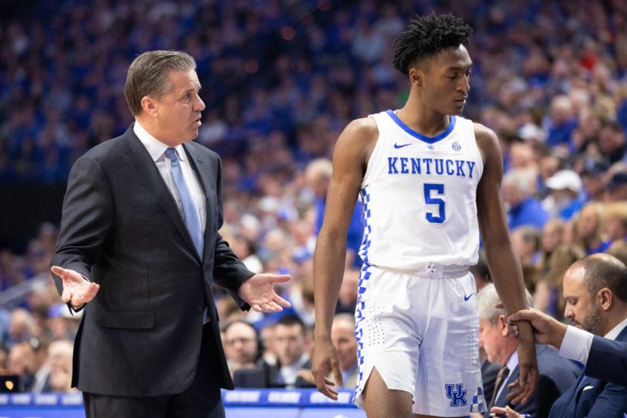 Kentucky head coach John Calipari talks to Freshman guard Immanuel Quickley while walking off of the court. UK mens basketball team played against Auburn at Rupp Arena on Saturday, Feb. 23, 2019 in Lexington, Kentucky. Photo by Michael Clubb | Staff
