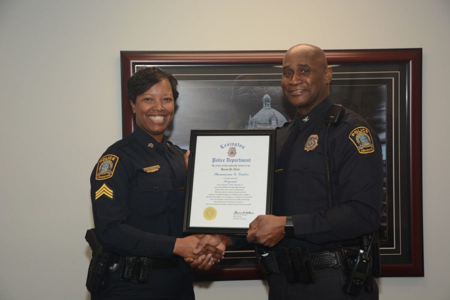 Thomasena Grider (left), the first black, female Lexington police sergeant is presented her official promotion by Lexington Police Chief Lawrence Weathers. Photo provided by the Lexington Police Department. 