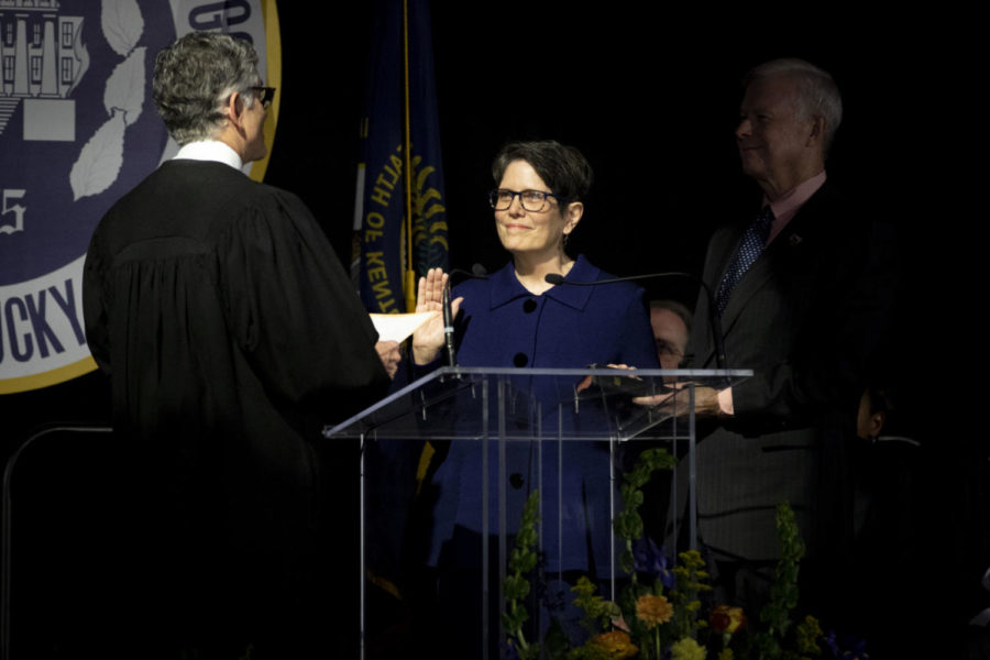 Fayette circuit judge Ernesto Scorsone administers the oath of office to Mayor Linda Gorton during her inauguration ceremony in the Gatton Student Center Grand Ballroom in Lexington, Kentucky. Photo by Arden Barnes | Staff