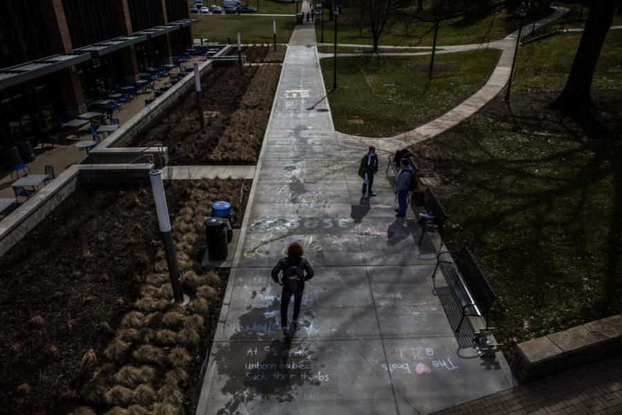 Pro-Life Wildcats created anti-abortion chalk drawings on a sidewalk leading towards the Gatton Student Center on Tuesday, Feb. 26, 2018, in Lexington, Kentucky. Photo by Arden Barnes