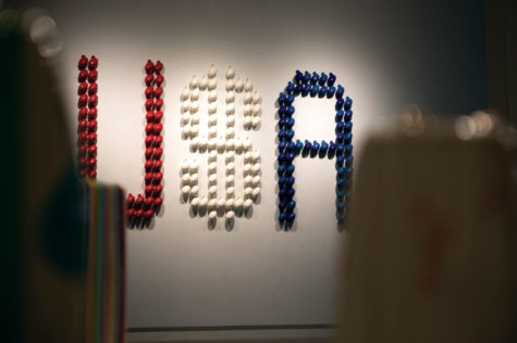 The letters USA made from grenades on a wall at artists Angela Carbone and Davis Bogus art exhibit Resistance at the Bolivar Art Gallery on Wednesday, Feb. 27, 2019, in Lexington, Kentucky. Photo by Michael Clubb | Staff