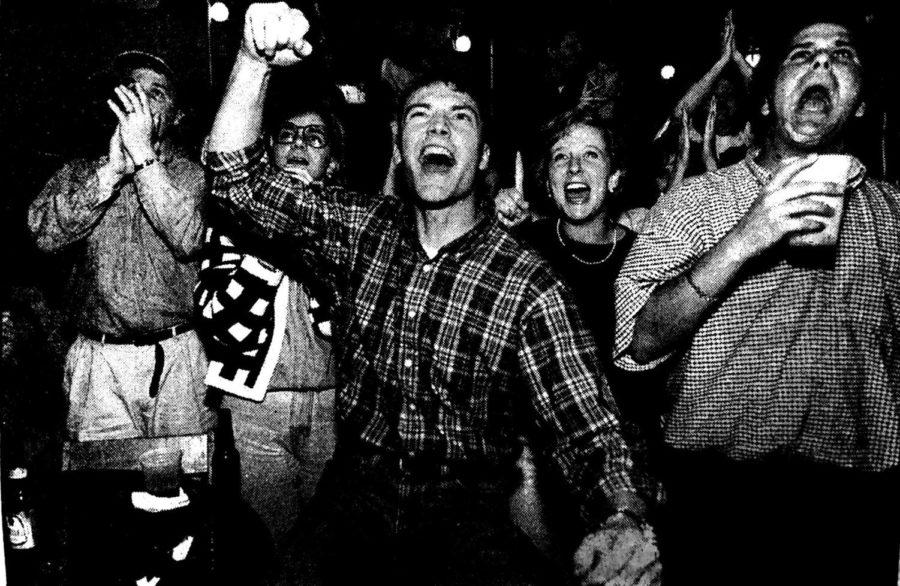 Kentucky fans celebrate at the corner of Woodland and Euclid on March 30, 1996, after Kentucky beat the University of Massachusetts 81-74, winning UK's sixth national championship.  