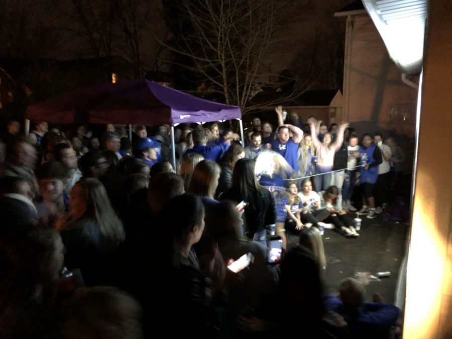 Kentucky fans watch the UK v. Houston game on State Street on March 29, 2019, in Lexington, Kentucky. 