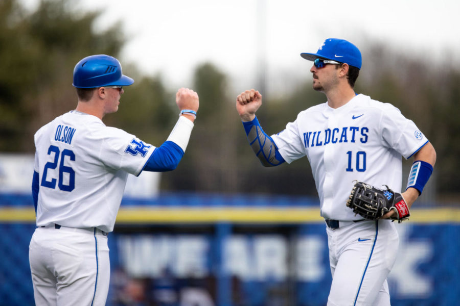 Kentucky freshman Justin Olson (26) greets junior Dalton Reed (10) as he enters the dugout during the game against SIUE on Tuesday, March 12, 2019, at Kentucky Proud Park in Lexington, Kentucky. Kentucky won 6-4. Photo by Jordan Prather | Staff