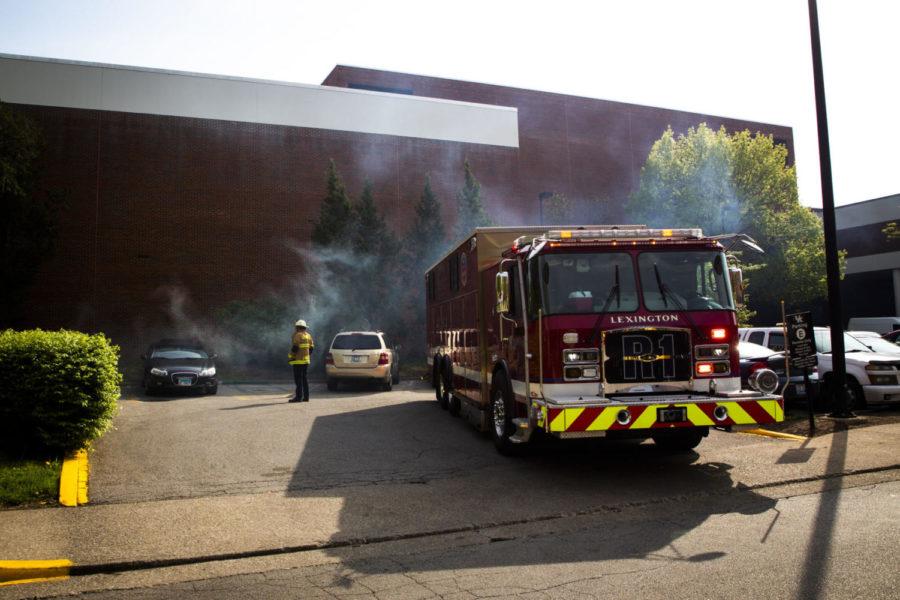 Lexington Fire Department Major Walter observes smoke coming from a vent outside the Singletary Center on UK's campus on Wednesday, April 24, 2019, in Lexington, Kentucky. Walter said it was most likely just a 