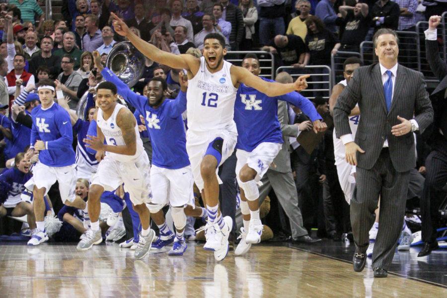 The Kentucky bench is lead by Karl-Anthony Towns onto the court after beating Notre Dame in the Elite 8 of the 2015 NCAA Mens Basketball Tournament against the at Quicken Loans Arena on Saturday, March 28, 2015 in Cleveland , OH. Kentucky won 68-66. Photo by Jonathan Krueger | Staff.