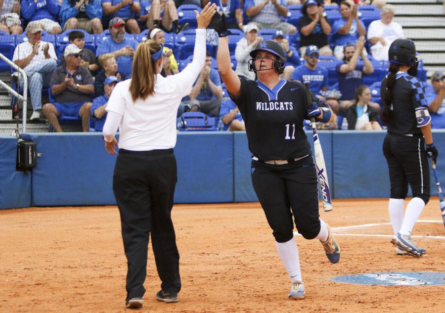 Kentucky+Wildcats+third+baseman+Abbey+Cheek+high+fives+head+coach+Rachael+Lawson+after+scoring+a+run+during+the+third+inning+of+the+championship+game+of+the+Lexington+Regional+at+John+Cropp+Stadium+on+Sunday%2C+May+21%2C+2017+in+Lexington%2C+KY.+Photo+by+Addison+Coffey+%7C+Staff.