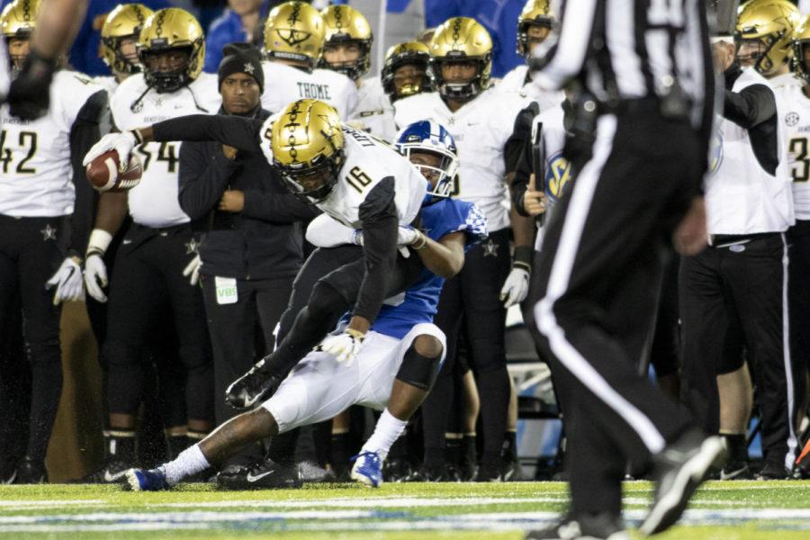 Kentucky Wildcats safety Davonte Robinson tackles Vanderbilt freshman defensive back BJ Anderson during the game on Saturday, Oct. 20, 2018, at Kroger Field in Lexington, Kentucky. Kentucky won 14-7. Photo by Arden Barnes | Staff