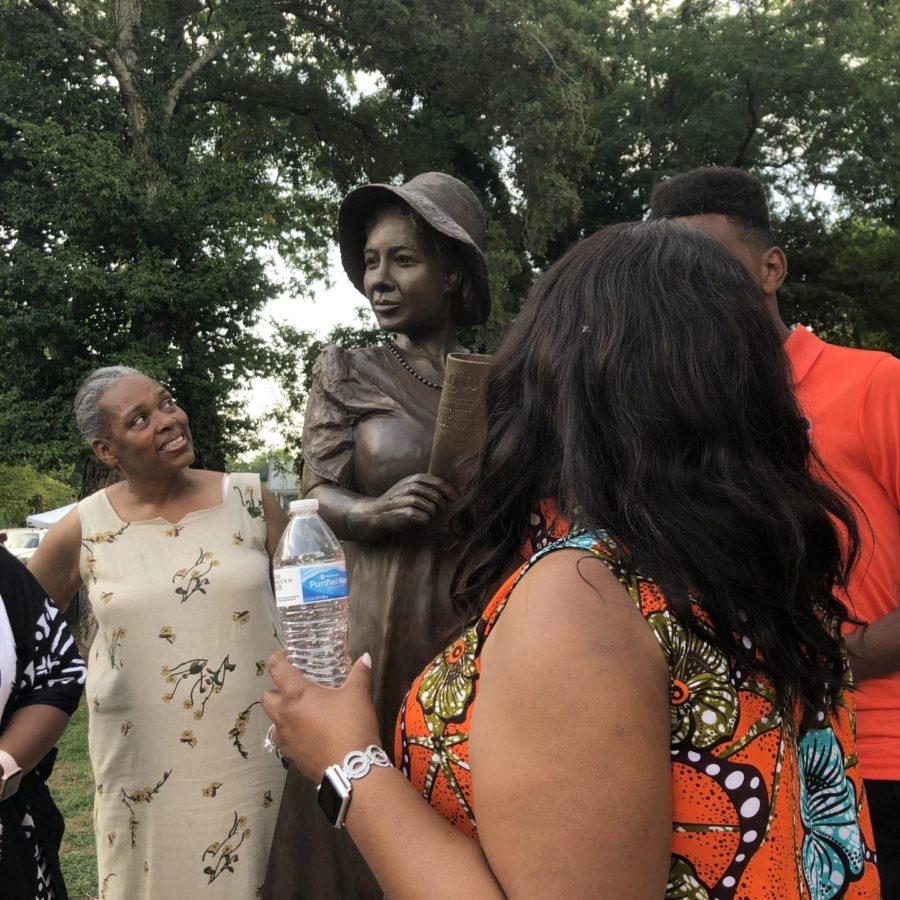 Members of Alice Allison Dunnigans family look up at her newly unveiled statue at the dedication ceremony on Friday, August 2, 2019, in Russellville, Kentucky. 