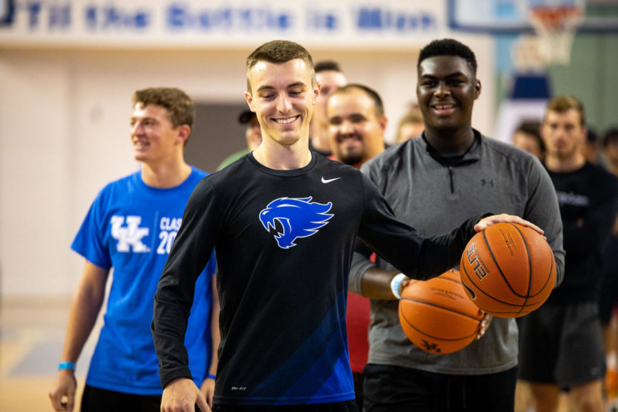 Participants wait to start another round during the attempt at the world's largest game of knockout basketball put on by UK Atheltics and CSF on Saturday, Aug. 24, 2019, at Memorial Coliseum in Lexington, Kentucky. The record was not broken. Photo by Jordan Prather | Staff