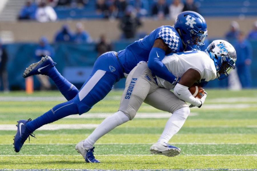 Kentucky Wildcats safety Davonte Robinson (9) tackles a MTSU player. University of Kentucky football defeated Middle Tennessee State University 34-23 at Kroger Field on Saturday, Nov. 17, 2018 in Lexington, Kentucky. Photo by Michael Clubb | Staff