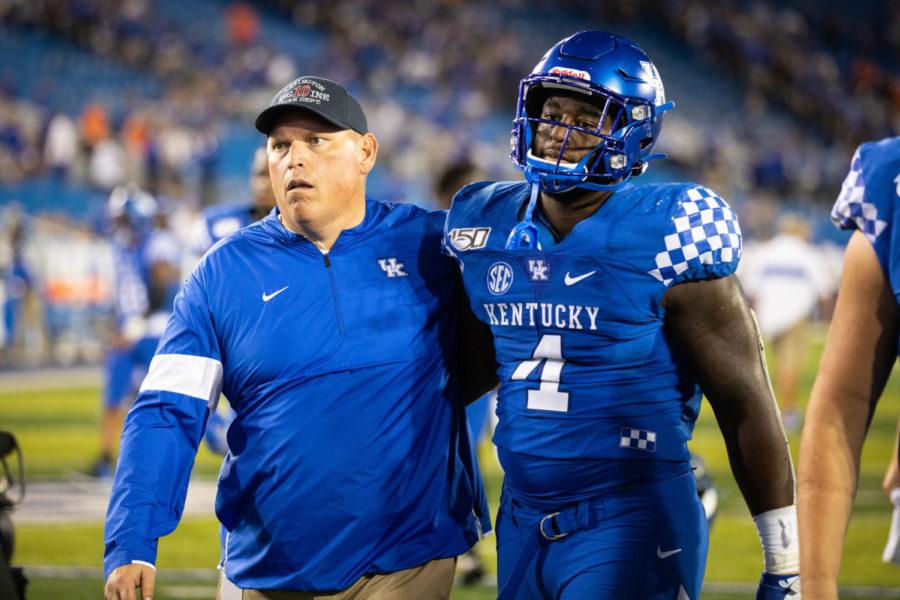 Kentucky+Wildcats+defensive+lineman+Joshua+Paschal+%284%29+and+offensive+lineman+coach+John+Schlarman+walk+off+the+field+after+the+UK+vs+Florida+football+game+on+Saturday%2C+Sept.+14%2C+2019%2C+at+the+University+of+Kentucky+in+Lexington%2C+Kentucky.+Florida+won+29-21.+Photo+by+Michael+Clubb+%7C+Staff