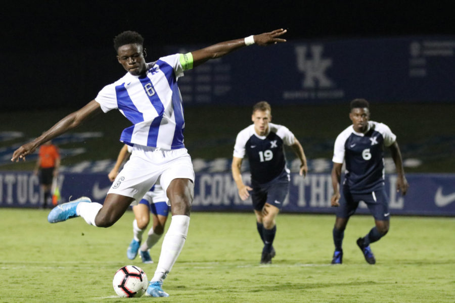 Defender Aime Mabika takes a penalty kick during the match against Xavier on Wednesday, September 11, 2019, in Lexington, Ky. Photo by Chase Phillips | Staff