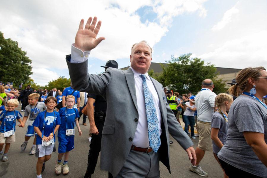 Kentucky Wildcats head coach Mark Stoops waves to fans during Cat Walk before the game against Eastern Michigan on Saturday, Sept. 7, 2019, at Kroger Field in Lexington, Kentucky. Photo by Jordan Prather | Staff