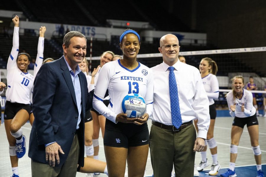 UK Athletics Director Mitch Barnhart and UK volleyball head coach Craig Skinner present outside hitter Leah Edmond with an honorary match ball commemorating her record-breaking 1,738th kill on Wednesday, October 23 in Memorial Coliseum before the LSU game. | Photo by Jordan Prather 