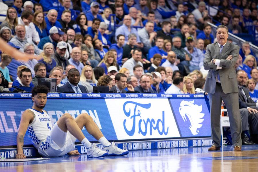 Kentucky head coach John Calipari coaches from the sidelines while Sophomore forward Nick Richards waits to be checked into the game. UK mens basketball team defeated Florida 66-57 on senior night at Rupp Arena on Saturday, March 9, 2019, in Lexington, Kentucky. Photo by Michael Clubb | Staff