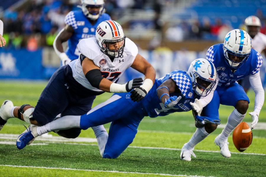 Two UK players dive after a live fumble during the University of Kentucky vs. UT Martin football game on Saturday, Nov. 23, 2019, at Kroger Field in Lexington, Kentucky. UK won 50-7. Photo by Michael Clubb | Staff
