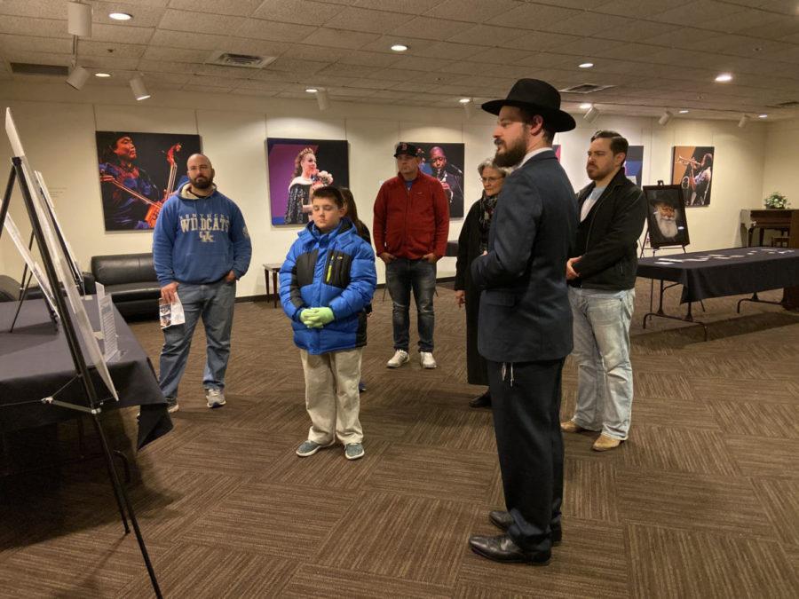 Rabbi Shlomo Litvin explains one of the exhibit pieces to a group who attended the showing of the Contemporary Anti-Semitism exhibit on Tuesday, November 12, 2019 in Lexington, Kentucky. Photo by Natalie Parks | Staff
