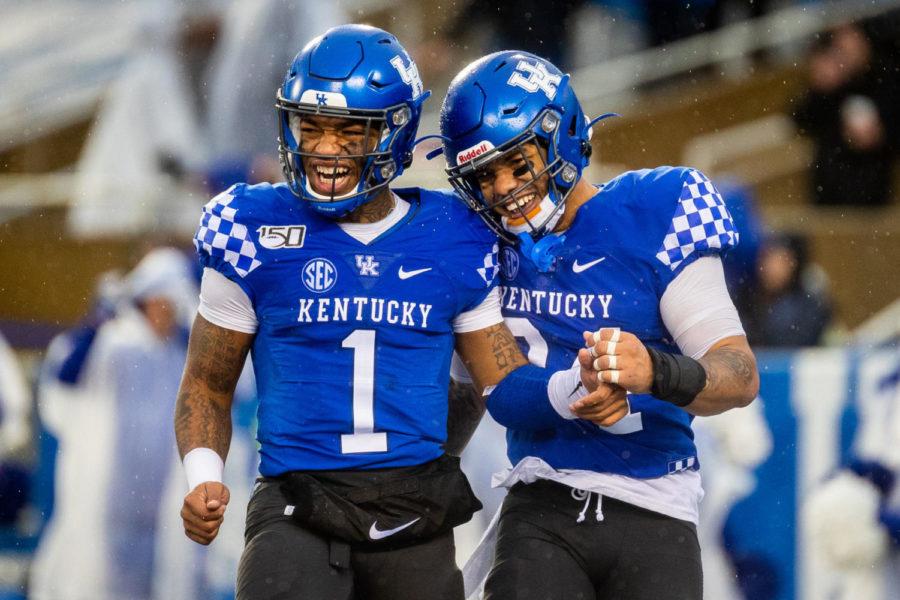 Kentucky Wildcats quarterback Lynn Bowden Jr. (1) and Kentucky Wildcats running back Christopher Rodriguez Jr. (24) celebrate after a UK touchdown during the University of Kentucky vs. University of Louisville Governor’s Cup football game on Saturday, Nov. 30, 2019, at Kroger Field in Lexington, Kentucky. UK won 45-13. Photo by Michael Clubb | Staff
