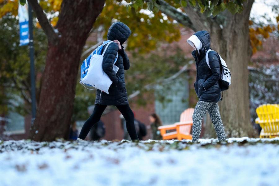 Two UK students walk past each other outside of the Whitehall Classroom Building during class change on Tuesday, Nov. 12, 2019, at the University of Kentucky in Lexington, Kentucky. Photo by Michael Clubb | Staff